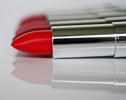 Photo of several tubes of red lipstick